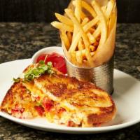 King Crab Grilled Cheese · Alaskan king crab, provolone and American, tomatoes.