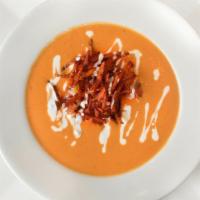 Chicken Tortilla Soup · Spicy Chicken Tomato Cream Topped With Tortilla Chips and Sour Cream