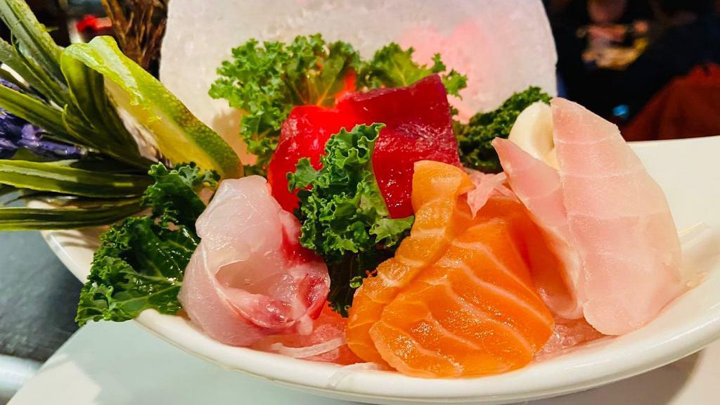 Sashimi Appetizer (9) · Assorted slices of raw fish.