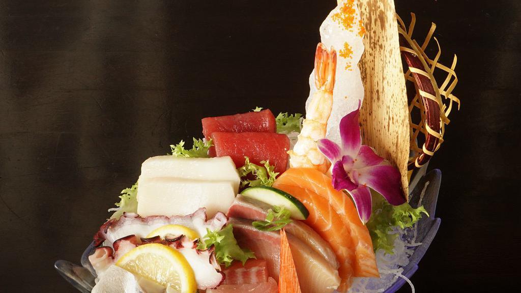 Sashimi Dinner Deluxe With Rice · Sixteen pieces assorted raw fish, chef's choice.