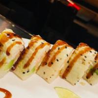 Rock 'N' Roll · Shrimp tempura, crab stick, avocado, mayo sauce and masago wrapped with soybean paper with e...