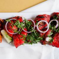 Tandoori Chicken · Chicken leg quarters in the chef's blend of herbs and spices broiled in the clay tandoor oven.