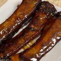 6 Bar-B- Q Ribs · Tasty marinated ribs baked and seared with our homemade Asian barbecue sauce