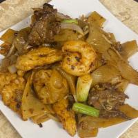 Combination Chow Fun · Combination of beef, chicken, and shrimp tossed in a high flame stir fry with bean sprouts a...