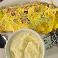 Tony'S Combo Omelette · Filled with bacon, sausage, ham, onions, and green peppers
