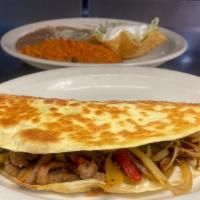 Quesadilla Fajita Dinner · Steak or chicken, grilled with onions bell peppers and tomatoes. Served with rice, beans, to...