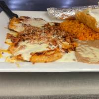 Chori-Pollo · Chicken breast covered with chorizo and cheese sauce. Served with rice, beans, lettuce and s...