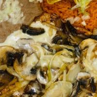 Pollo Maravilla · Grilled chicken topped with onions, mushrooms and cheese. Served with rice, beans and tortil...