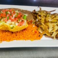 Carne Asada · Tender thin slices of rib-eye steak, served with rice, beans, pico de Gallo and tortillas