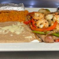 Steak Veracruz · T-bone steak and shrimp, topped with grilled onions, bell peppers, tomatoes. Served with ric...
