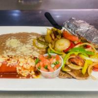 Steak Hidalgo · Rib-eye steak cooked with grilled peppers, onions, tomato, served with one chicken enchilada...