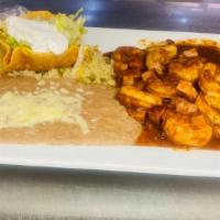 Camarones À La Diabla · Shrimp with ham and hot sauce. Served with rice and beans.