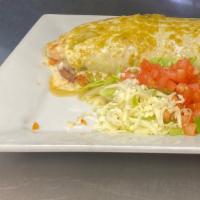 Burrito Texano · Filled with steak, chicken, shrimp, rice and black beans  inside, lettuce and sour cream. To...