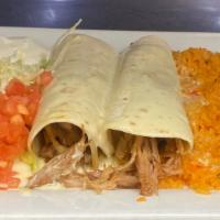 Ranchero Burrito · Two fried pork burritos with grilled onions and tomatoes, topped with cheese sauce,served wi...