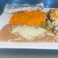 Alambre · Steak, chicken, shrimp, chorizo, pineapple, pepper, onions, tomato, and cheese served with r...