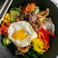 Bibimbap · Rice bowl served with assorted vegetables, choice of protein, fried egg and gochujang sauce.