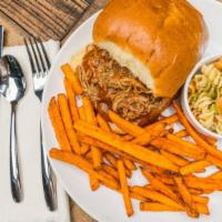 Smoked Pulled Pork Sandwich Meal · Slow smoked, hand pulled apart and topped in our famous BBQ sauce.  Served on a brioche bun ...