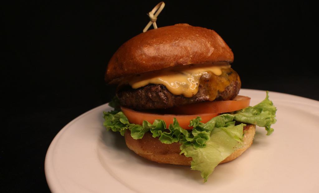 Four Points Classic Burger · Four points favorites. 1/2 lb Angus beef topped with Wisconsin aged cheddar cheese, lettuce, onion, and tomato on a brioche bun.