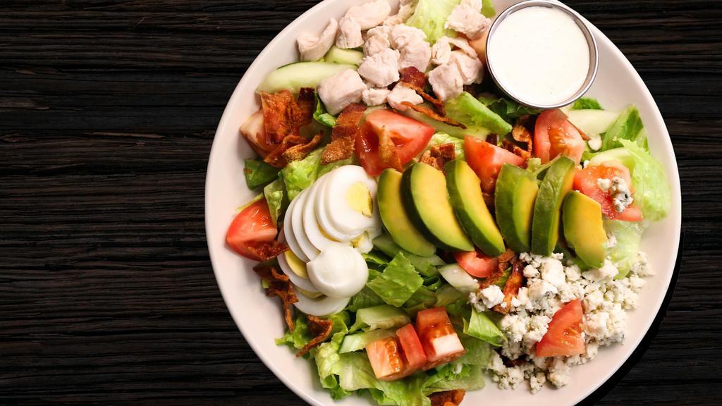 Chopped Salad · Four points favorites. Chopped romaine lettuce, tomato, cucumber, pickled onion, blue cheese, avocado, and hard-cooked egg served with red wine vinaigrette.