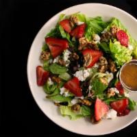 Strawberry Walnut Salad · Spring mix, walnuts, goat cheese, and quartered strawberries served with balsamic vinaigrett...