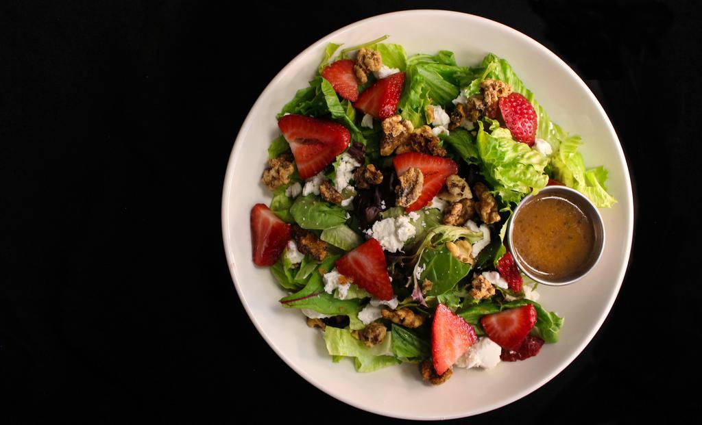 Strawberry Walnut Salad · Spring mix, walnuts, goat cheese, and quartered strawberries served with balsamic vinaigrette dressing.