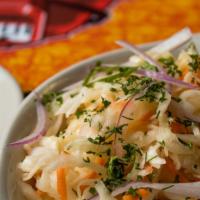 Russian Kraut · Gluten free. Lightly marinated, crunchy cabbage, carrots, cranberries, caraway and cold pres...