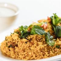 Veg Biryani · Long grain basmati rice cooked with vegetables and homemade spices. Served with raita.