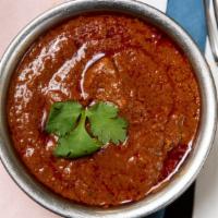 Butter Chicken · Tandoori chicken chunks tossed in tomato paste, cashew paste and butter gravy with Mumbai gr...