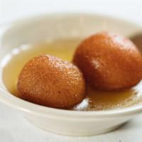 Gulab Jamun · Deep fried balls made with sugar, flour, butter, sweet cheese in sugar syrup.