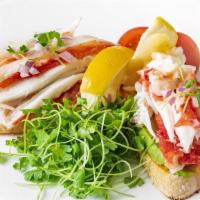 Tostadas Con Centollo · Toast points topped with avocado relish and Alaskan king crab meat