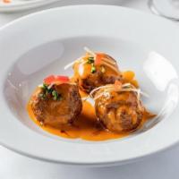 Albóndigas Con Almendras · Lamb, beef and pork meatballs served with spicy tomato sauce, toasted almonds and parmesan