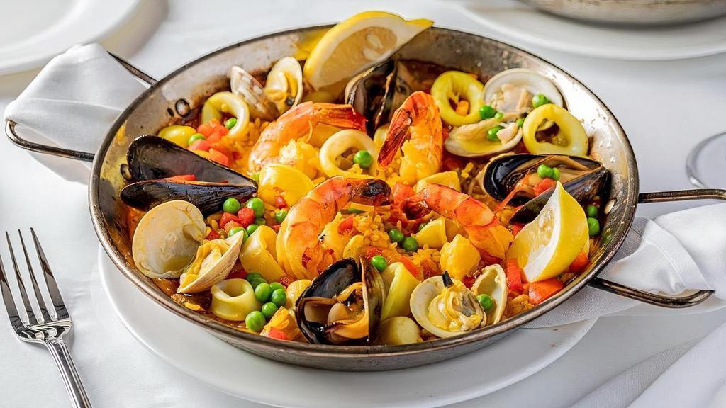 Mariscos · Saffron rice with shrimp, mussels, clams, scallops and octopus