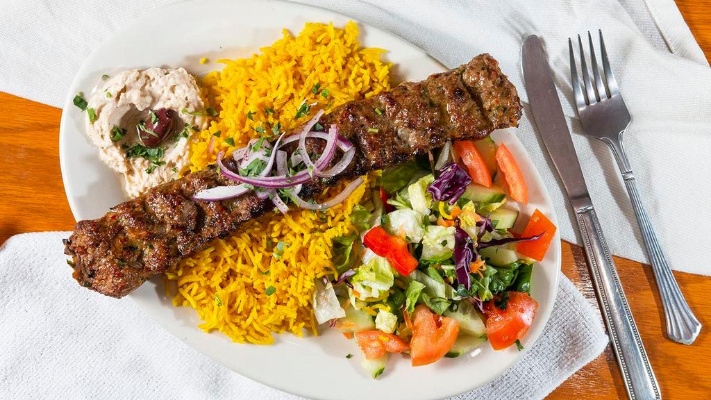 Ground Lamb & Beef Kabob On Skewer · Charbroiled seasoned ground cuts of tender lamb and beef minced onion and parsley served with rice, hummus, salad, and pita bread.