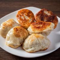 Pot Stickers 锅贴 (6) · Steamed or pan-fried. Fill with Pork and Vegetable.