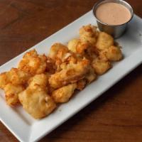 Cheese Curds · Wisconsin white cheddar curds, beer battered & fried. Served with siracha ranch dipping sauc...