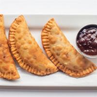 Empanadas · Housemade empanadas filled with grilled squash, grilled peppers & goat cheese. Served with C...