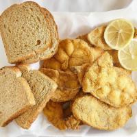 Catfish Steak Dinner · Six pieces. Includes fries, coleslaw, dinner roll, and lemon wedge.