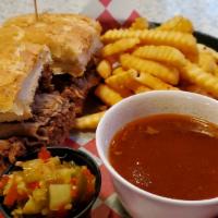 Italian Beef · The best beef in town! Slowly roasted then sliced thin and piled high. With au jus and peppe...