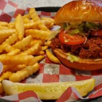 Classic Chicken Sandwich · Hand breaded and fried chicken breast, topped with lettuce, tomato, mayonnaise on a brioche ...