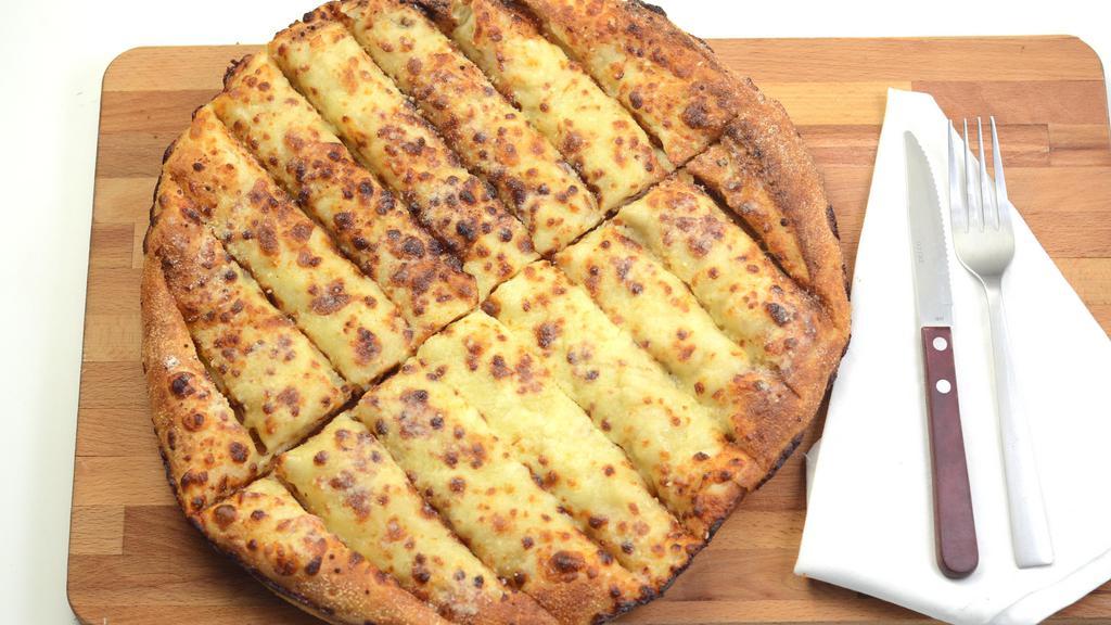 Cheesy Bread · Sixteen pieces of cheesy bread served with pizza sauce on the side for dipping.