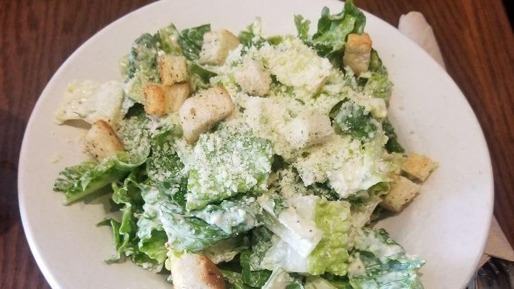 Classic Caesar · Romaine tossed with housemade croutons, Parmesan and caesar dressing.