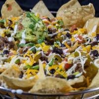 Nachos · Choice of protein, topped with cheese, black beans, sour cream, pico de gallo, jalapenos and...