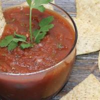 Large Fresh Salsa & Chips · Homemade fresh salsa made with fresh tomatoes, onions, cilantro and serrano peppers with a s...