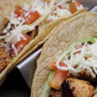 Taco Lunch · Two Mexican style or American style tacos served with rice, refried beans and salsa on the s...