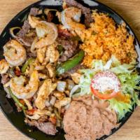 Mix Fajita · Shrimp, chicken and beef rice, beans, salad and corn tortillas.