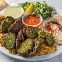 Vegetarian Combination · Vegan, vegetarian. Hummus, tabouli, and two pieces of falafel, pita and a side of tahini sau...