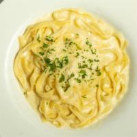 Fettuccine Alfredo · Creamy alfredo sauce over fettuccine.