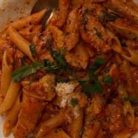Pasta Arrabbiata · Italian sausage link or sliced chicken breast sauteed with garlic & fresh herbs tossed in sw...
