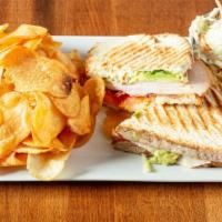 Turkey Bacon Avocado Panini · Sliced turkey breast and bacon with thinly sliced tomatoes and avocado smothered in mozzarel...