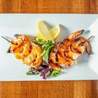 Firecracker Shrimp Skewers · Grilled and glazed with a spicy-sweet marinade.